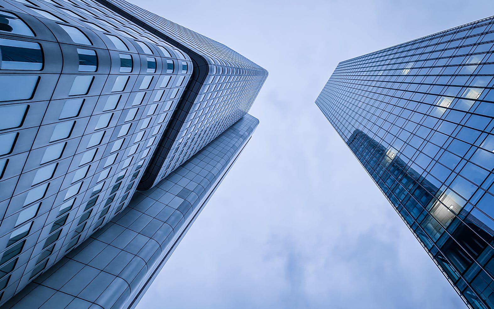 Low angle shot of two modern skyscrapers in Frankfurt am Main, Germany.